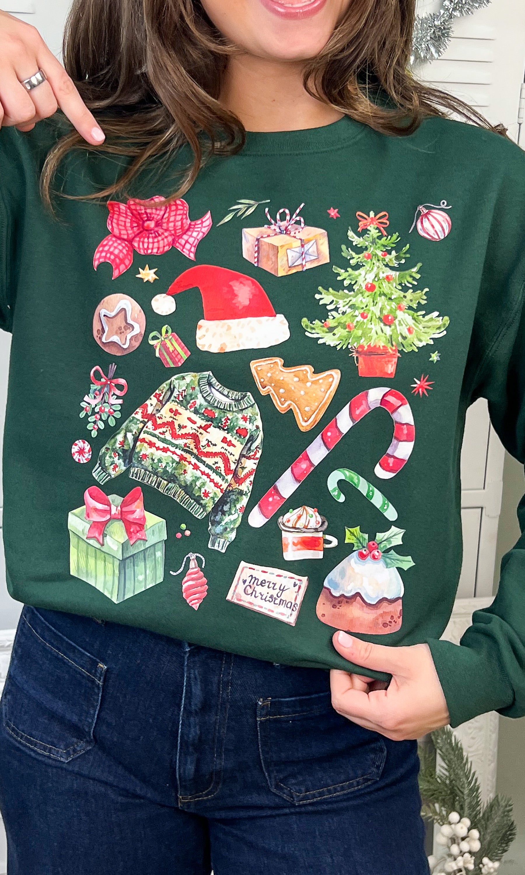 Festive Christmas Collage Graphic Sweatshirt featuring colorful holiday designs, perfect for celebrating the season.