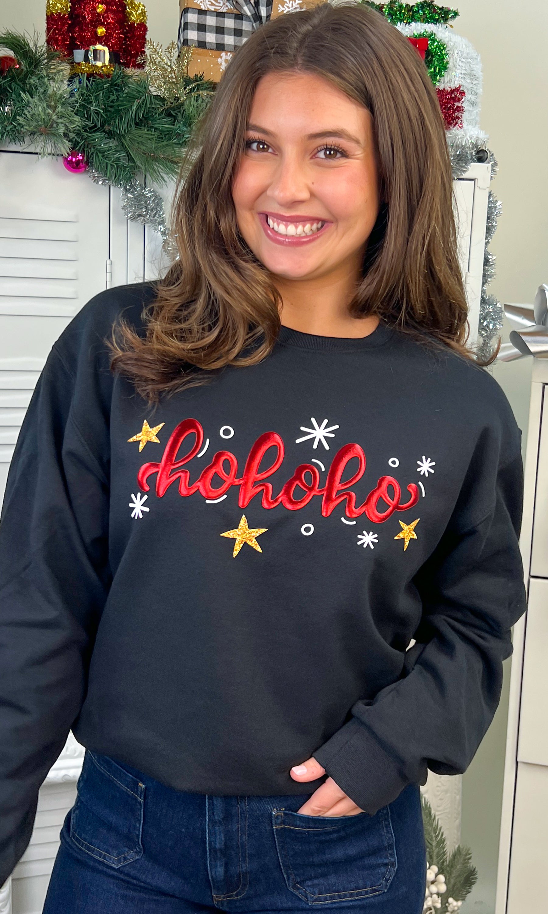 Cheerful model showcasing the HoHoHo Metallic Puff Christmas Graphic Sweatshirt, perfect for festive celebrations.