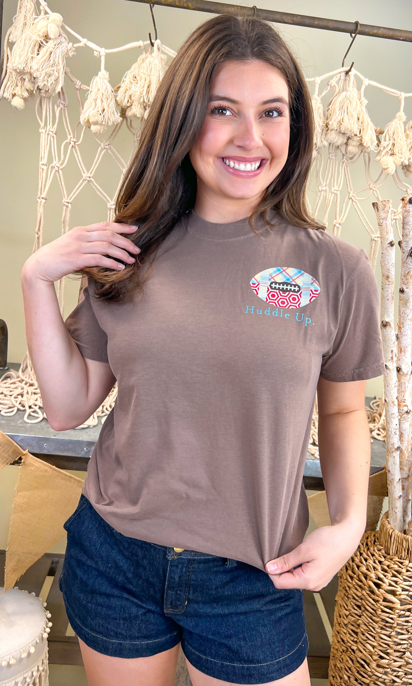 Stylish Huddle Up Love Football Comfort Color Graphic T-Shirt by Comfort Colors, perfect for football fans.
