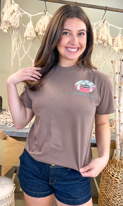 Stylish Huddle Up Love Football Comfort Color Graphic T-Shirt by Comfort Colors, perfect for football fans.