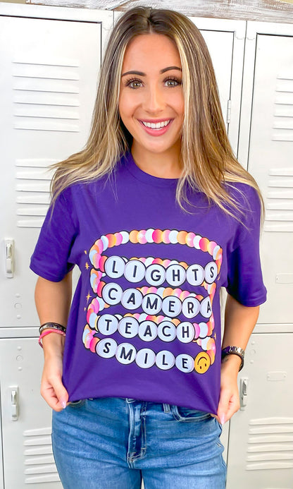 Lights Camera Teach Smile Purple Graphic T-Shirt