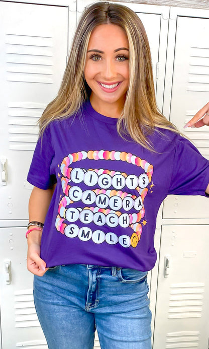 Lights Camera Teach Smile Purple Graphic T-Shirt
