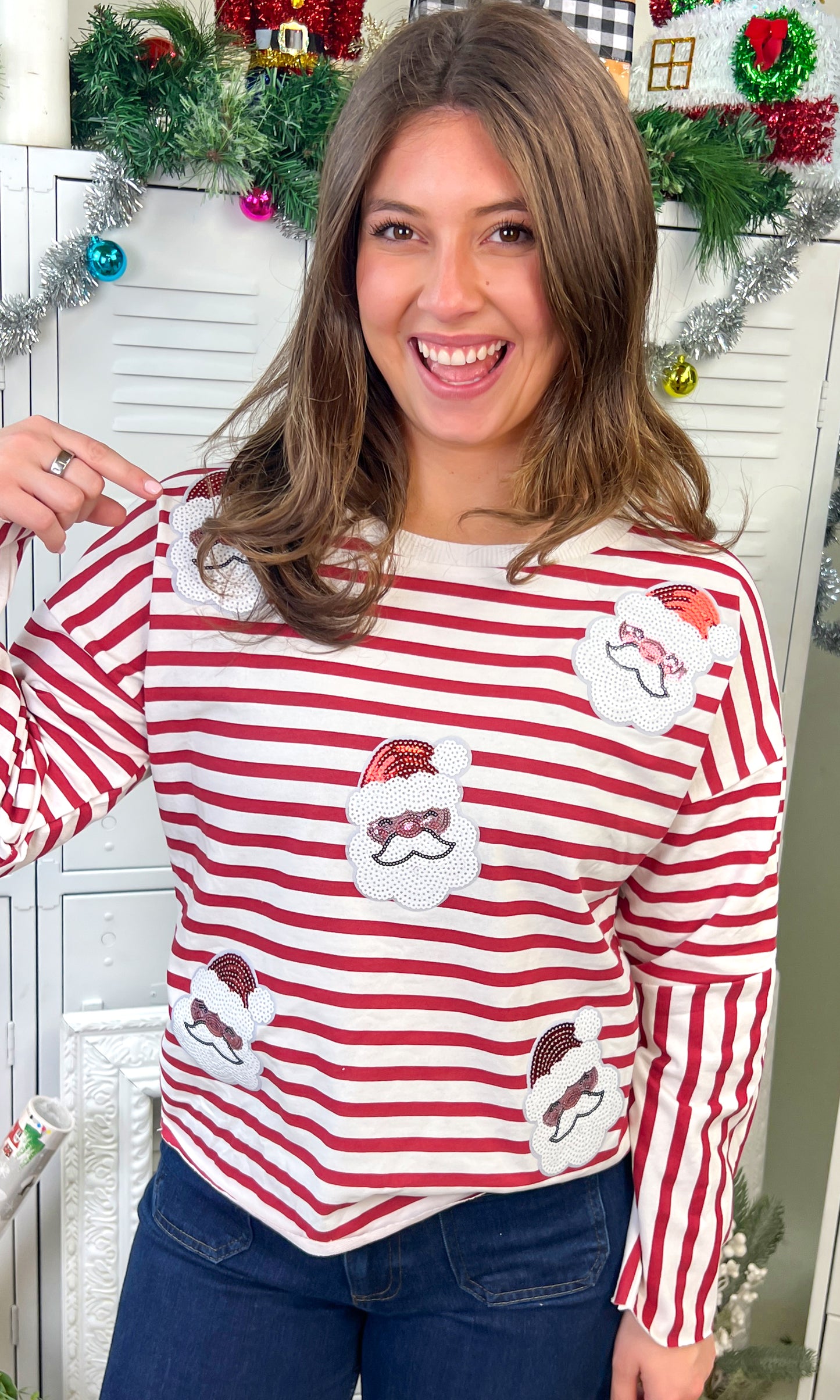 Celebrate the season in the Santa Christmas Sequin Long Sleeve Edgy Graphic Shirt, featuring festive striped design and sequins.