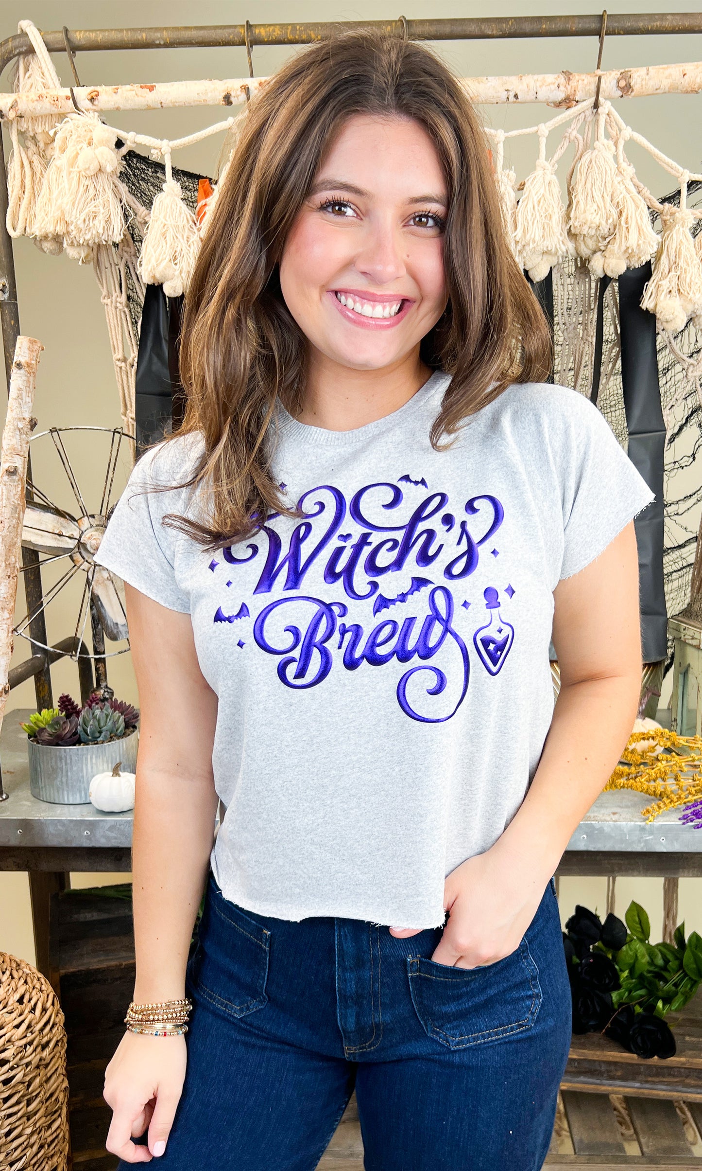 Witch's Brew Halloween Edgy Graphic Shirt featured on a model, perfect for spooky season celebrations.
